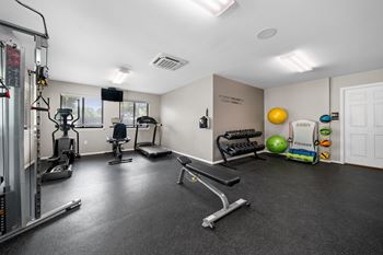 24-hour fitness center at Woodland Villa Apartments in Westland, MI.