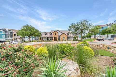 A residential area with houses and greenery.