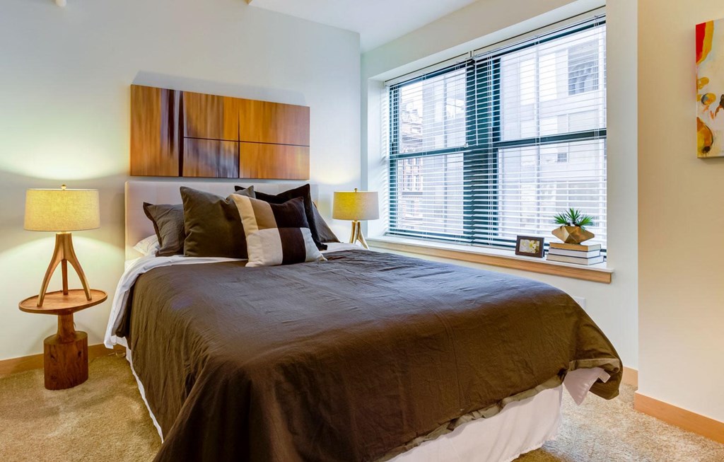 Bedroom with specious window at Arcade Artist Apartments, St Louis, MO, 63101