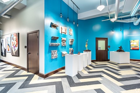 A room with blue walls and a white reception desk.