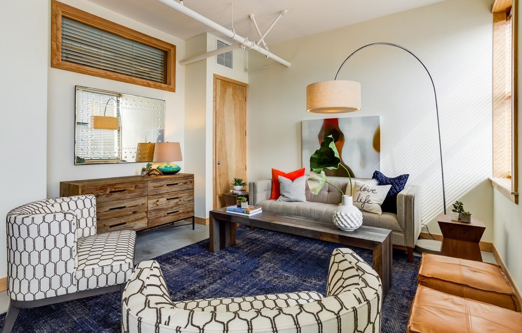 Living room with natural sunlight at Arcade Apartments, St Louis, MO