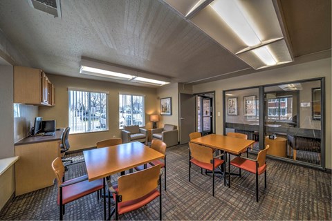 a dining room with tables and chairs