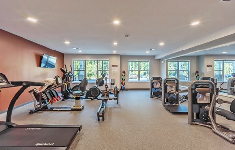 Fitness Center with equipment Fitness Center with equipment at Covington Crossings 55+ Senior Living, Georgia