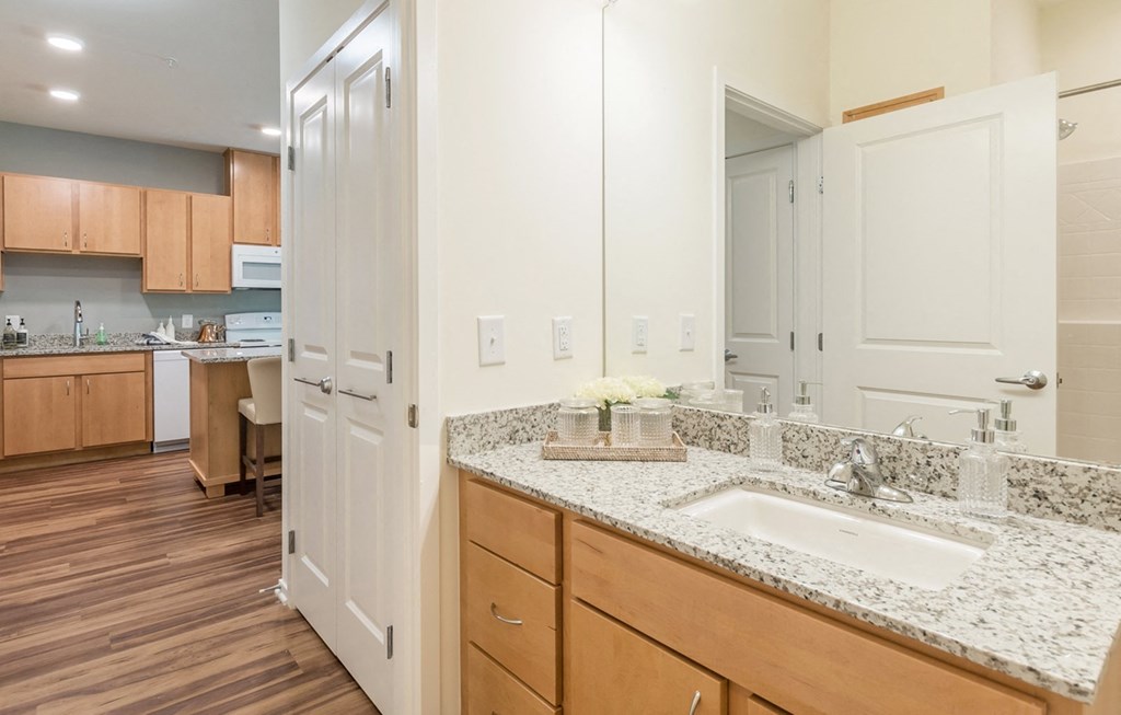 Bathroom with mirror at Covington Crossings 55+ Senior Living, Covington, 30014