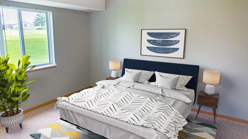 a bedroom with a large bed and a window at The Villages at Essex Park, Rochester, MN