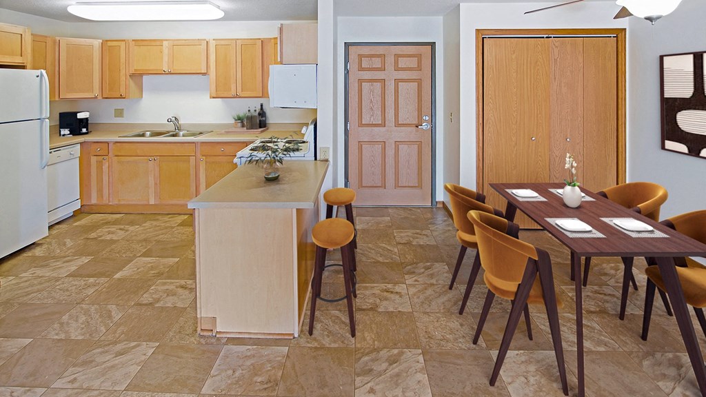 a kitchen and dining room with a table and chairs at The Villages at Essex Park, Rochester, 55901