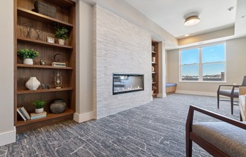 Library at Harbor at Twin Lakes 55+ Apartments, Roseville, MN - Photo Gallery 17