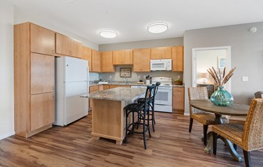 Model Dining Room and Kitchen at Legacy Commons at Signal Hills 55+ Apartments, West St. Paul, MN, 55118 - Photo Gallery 2
