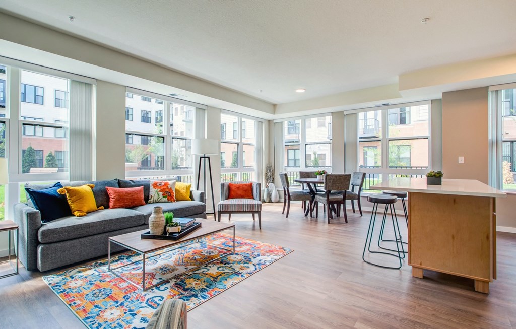 Living Room With Oversized Windows And Doors at The Legends at Berry 62+ Apartments, Minnesota 55114