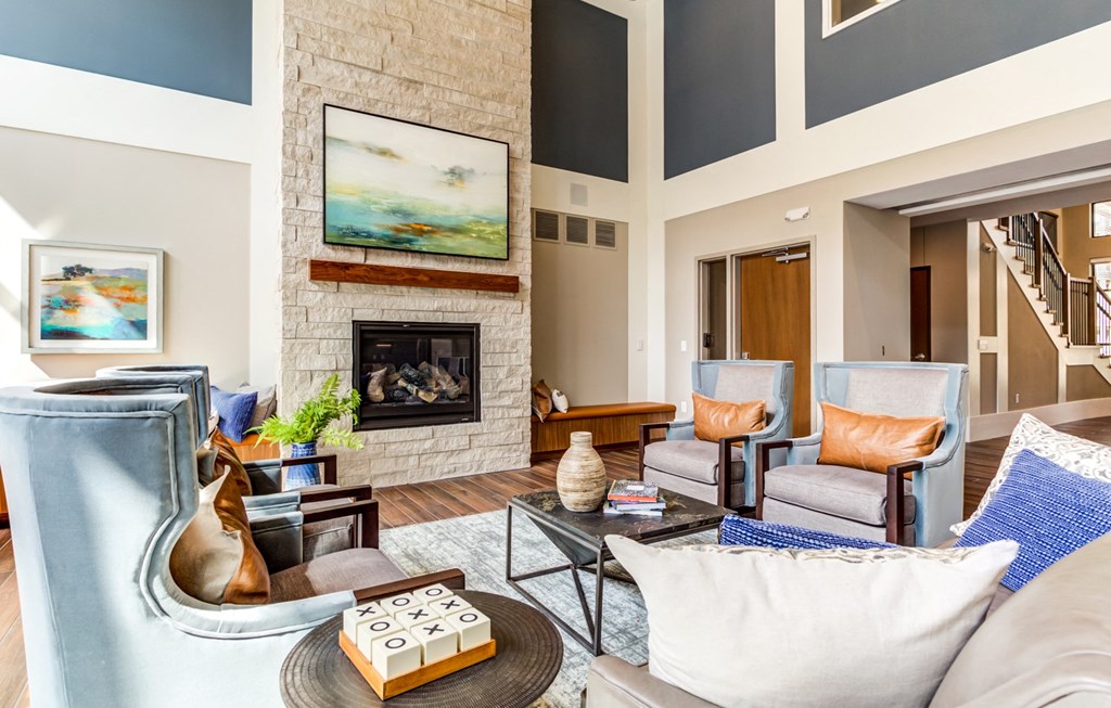 Extra Comfortable Sofa Chair In Living Room at The Legends at Berry 62+ Apartments, St. Paul, MN 55114