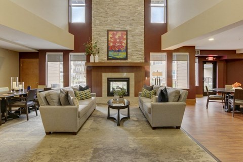 Community Room with sitting area at The Legends at Silver Lake Village 55+ Apartments, St. Anthony, Minnesota
