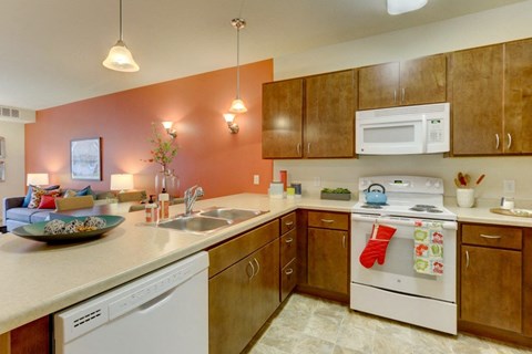 Kitchen with gas stove at The Legends at Silver Lake Village 55+ Apartments, St. Anthony, Minnesota, 55421