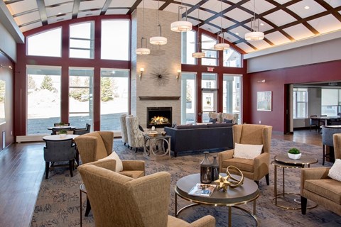 a large living room with furniture and a fireplace