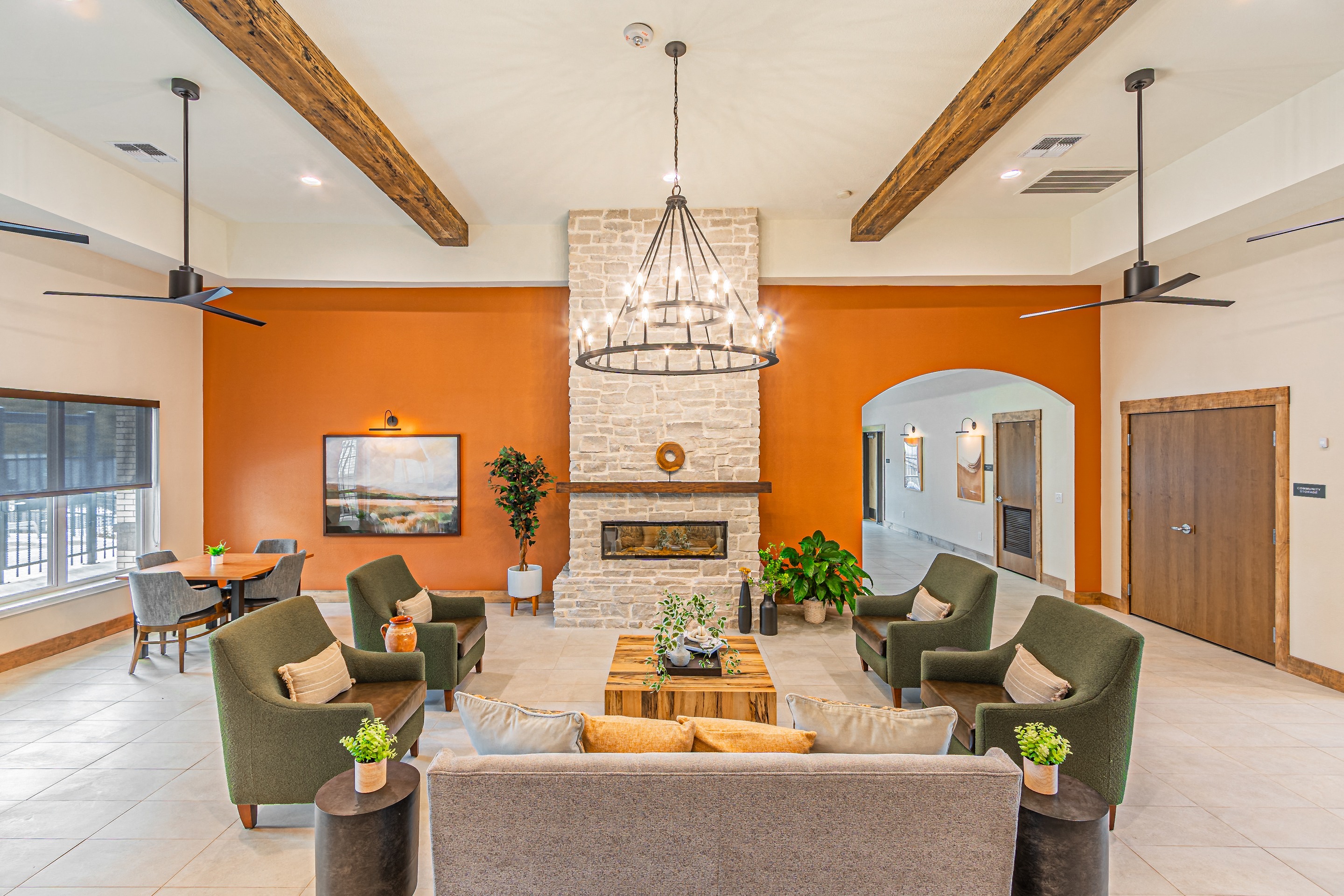 a living room with couches and chairs and a fireplace