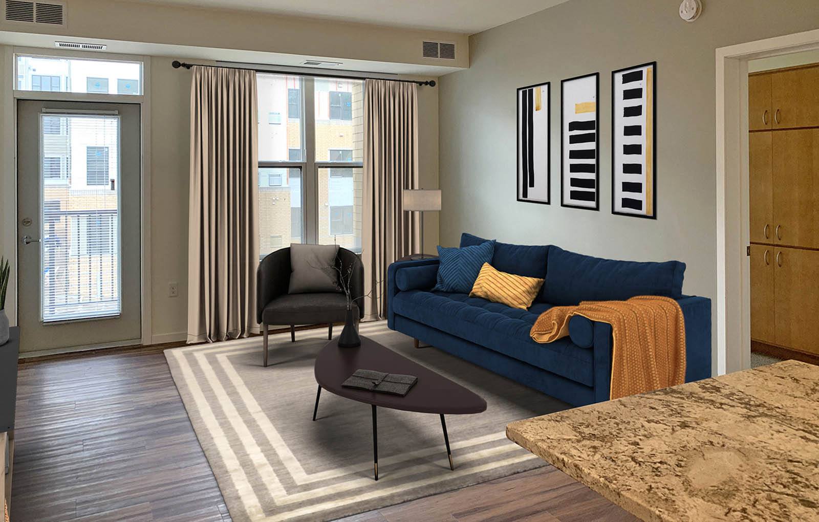 a living room with a blue couch and a table