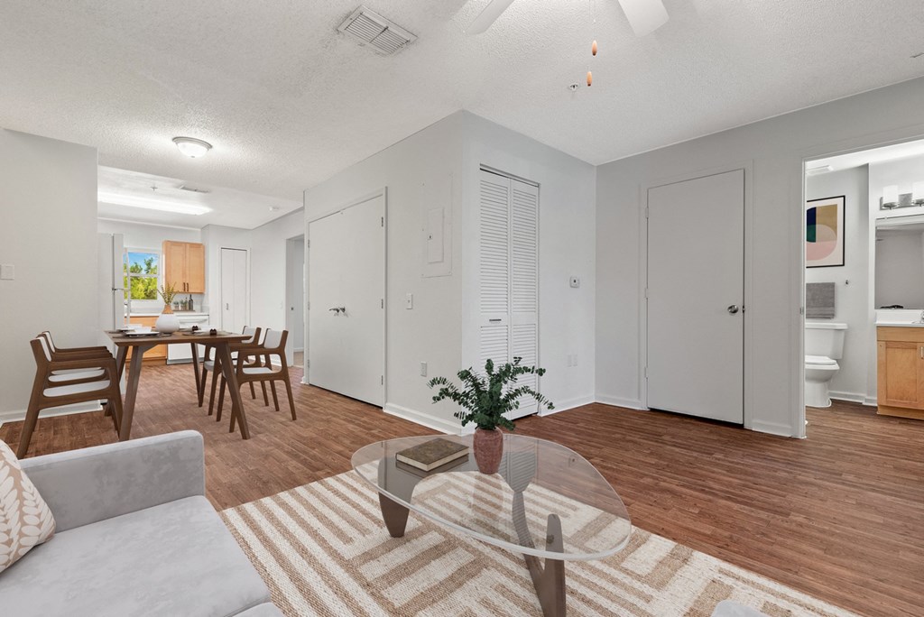 a living room and dining room with a couch and a table