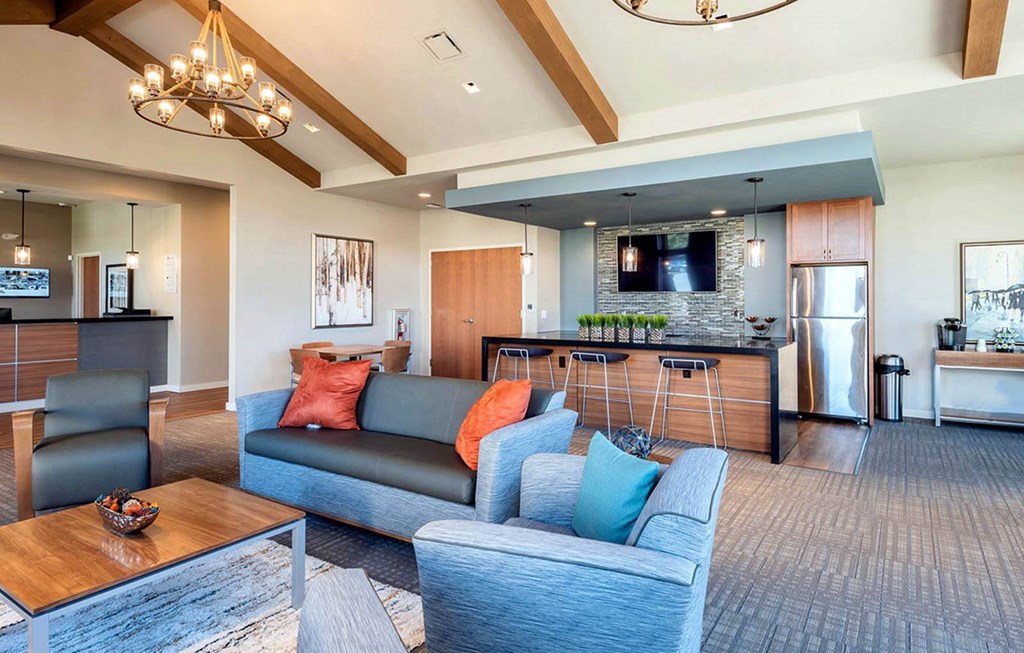 Community Room with couch at RiverEast, Council Bluffs, IA, 51501