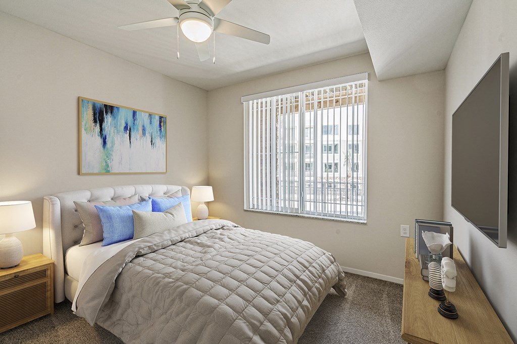 Bedroom with cozy bed at Sandpiper Glen 62+ Apartments, Orlando