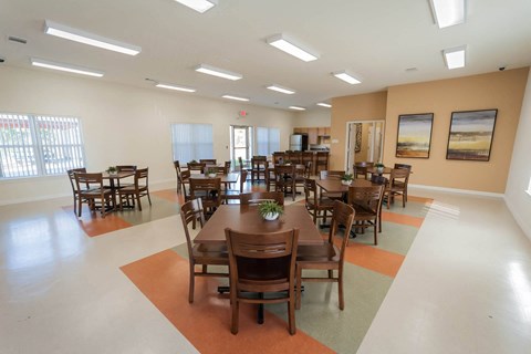 a dining room with tables and chairs in a hall