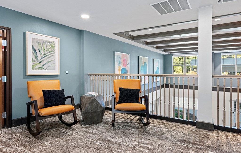 Clubroom seating area with couch at Stonepointe 55+ Apartments, Lithonia