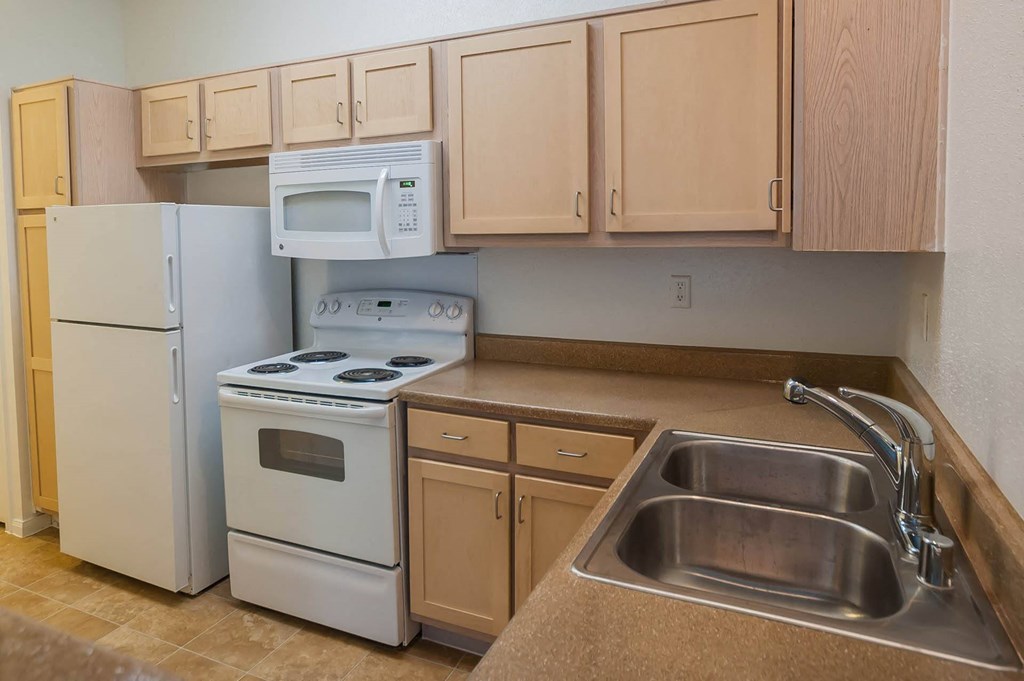 Kitchen With Refrigerator at Villa Springs, Houston, Texas, 77090