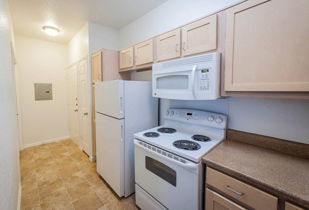 Kitchen with gas stove at Villa Springs, Houston, TX