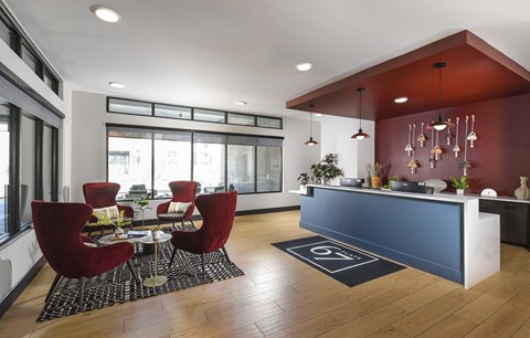 A modern living room with a dining table and chairs.