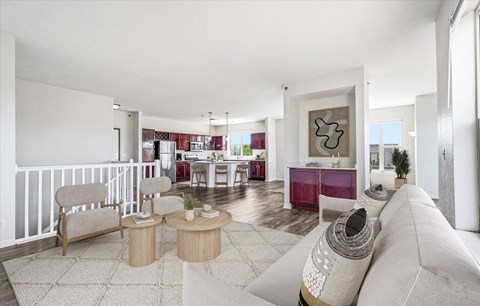 A living room with a white couch and a coffee table.