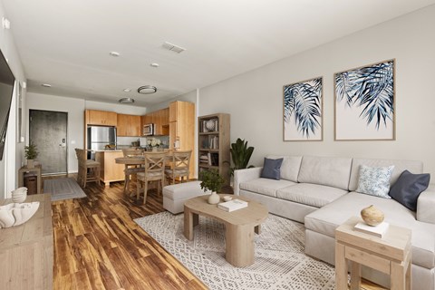A modern living room with a wooden floor and white walls.