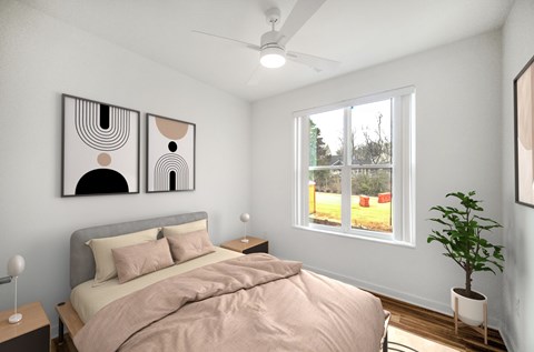 A bedroom with a bed, a ceiling fan, and two abstract paintings on the wall.
