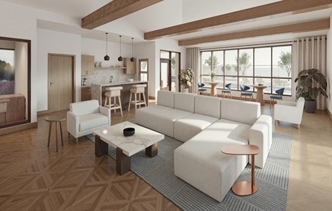 A modern living room with a large white sofa and a coffee table.