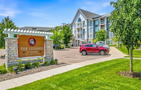 The Legends of Champlain Senior Living sign in front of a building.