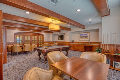 a game room with a pool table and tables at Sylvia at South Broadway 55+ Apartments, Texas, 76058
