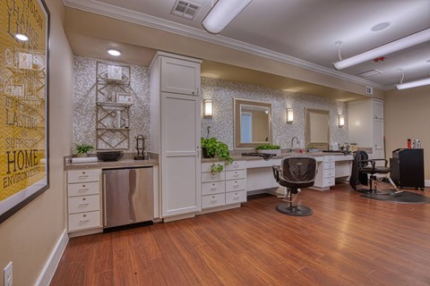 an office with a wood floor and a desk and a chair at Sylvia at South Broadway 55+ Apartments, Texas