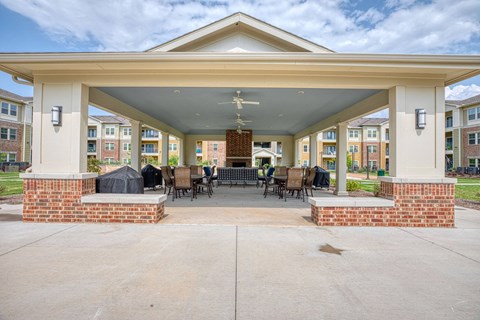 the preserve at ballantyne commons covered patio at Sylvia at South Broadway 55+ Apartments, Texas, 76058