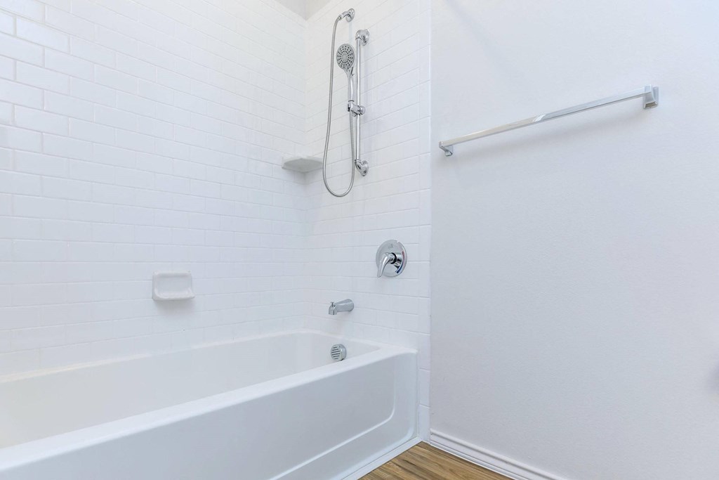 a white bathroom with a shower and a tub at Mariposa at Westchester, Grand Prairie, 75052