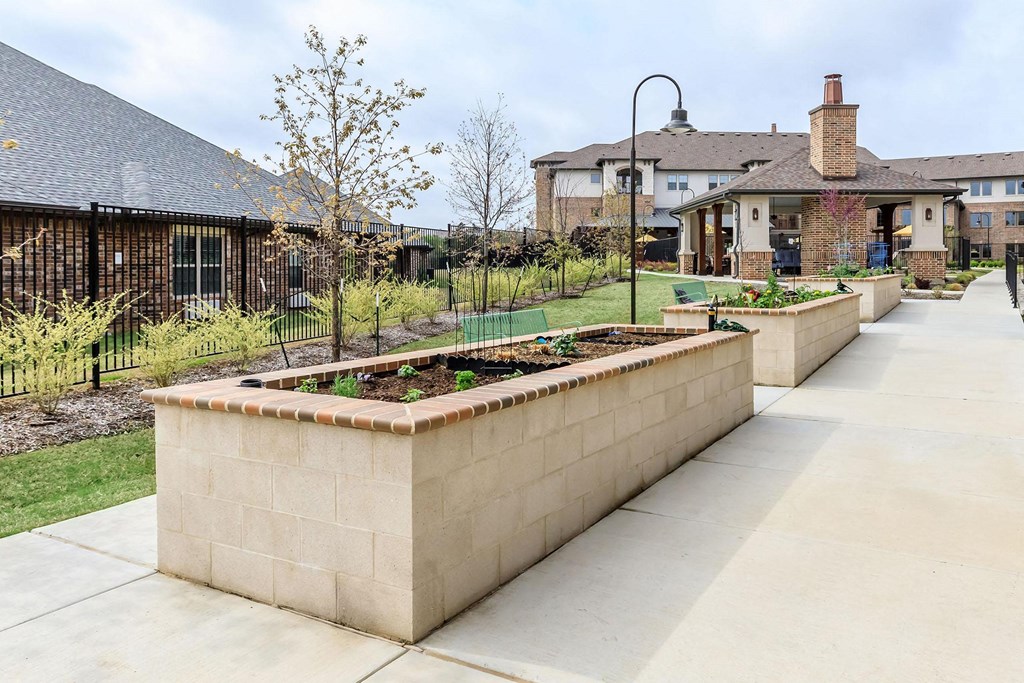 the raised garden in the front yard of a house at Mariposa at Westchester, Grand Prairie Texas