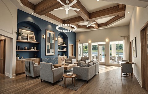 A spacious living room with a grey sofa set and a wooden ceiling fan.