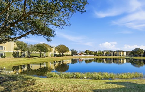 Serene Landscape with a Pond at Orchard Grove Apartments, Vero Beach, FL