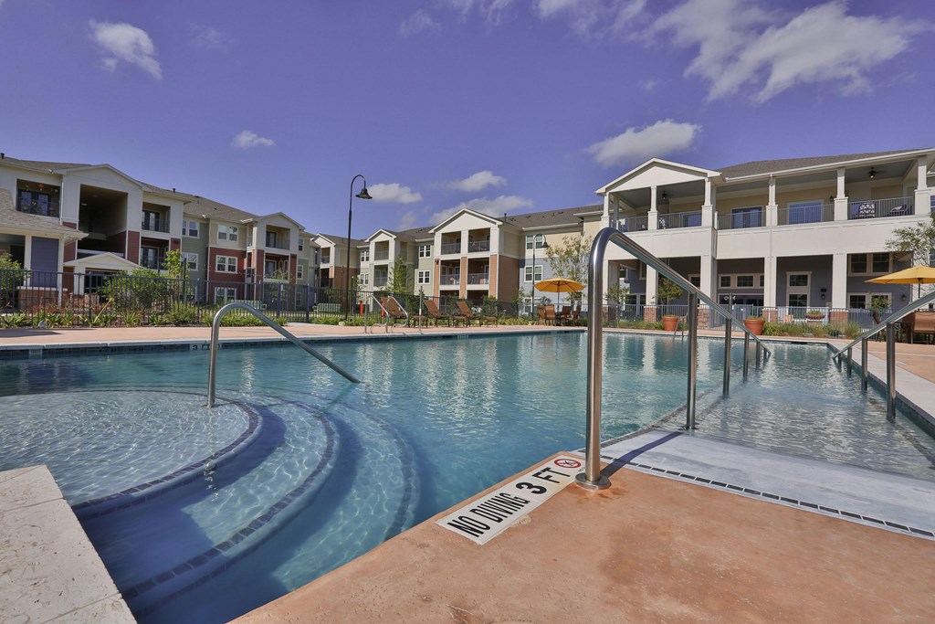 a swimming pool at Pacana Park 55+ Apartments, La Porte