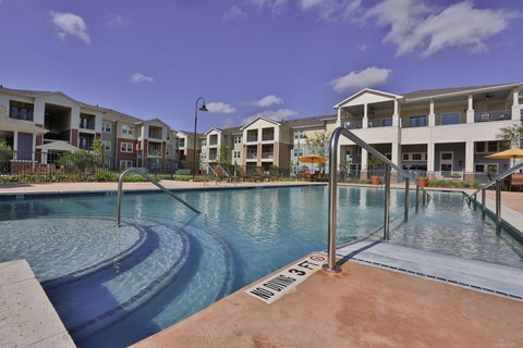 a swimming pool at Pacana Park 55+ Apartments, La Porte
