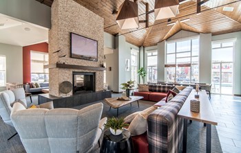 Clubroom With Smart Tv And Fireplace at South Range Crossings - Photo Gallery 5