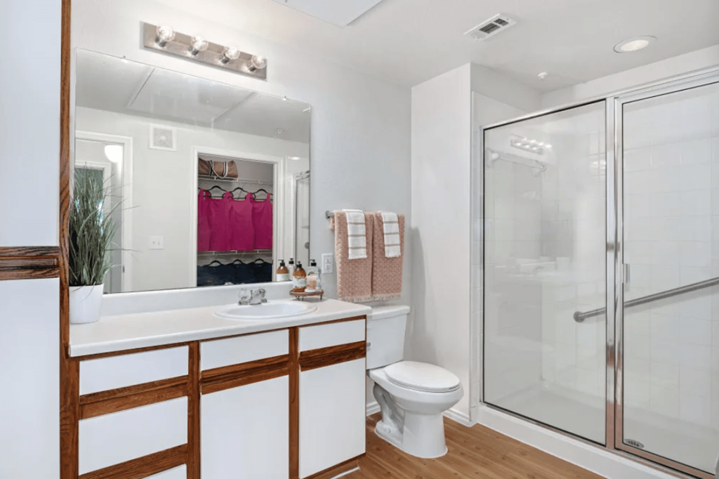 a bathroom with a shower and a sink and a toilet at Belle at Bay Colony 55+ Apartments, Texas, 77539