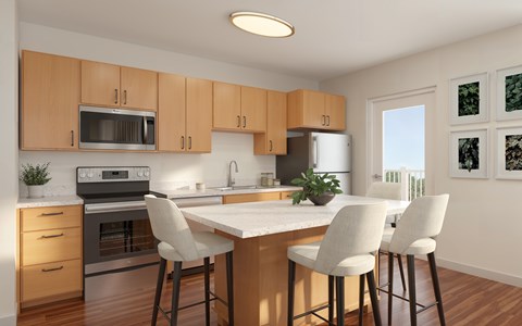 A kitchen with a table and chairs.