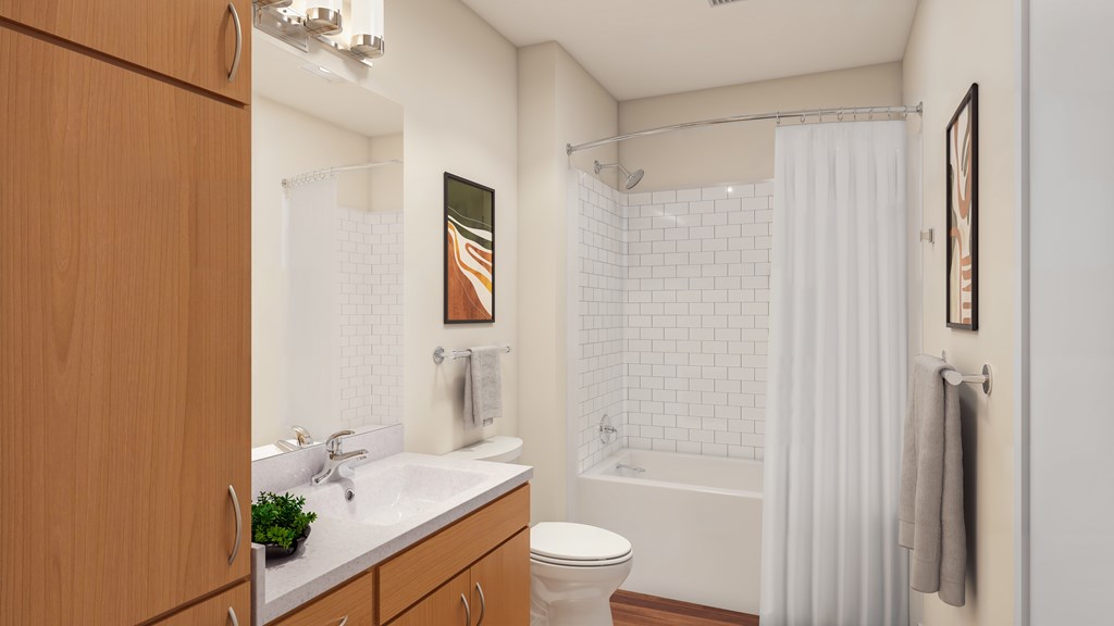 A bathroom with a white sink, toilet, and shower curtain.