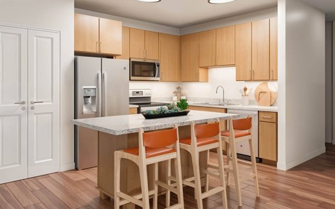 A kitchen with wooden cabinets and a white countertop.