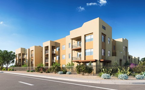 A modern apartment building with a clear blue sky above at Sandoval Flats Apartment , Rio Rancho, Minnesota