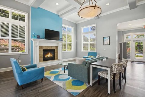 A living room with a fireplace and a television.