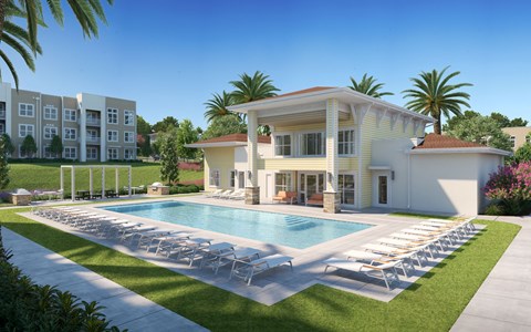 A large white house with a pool in front at The Mira Apartments, Apopka, Florida