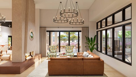 A modern living room with a brown sofa and a large window.